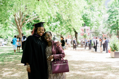 Graduating student photographed with mother